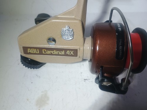 Abu cardinal gold made in - 4x,